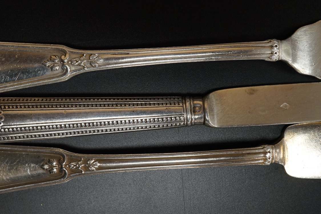 Eighteen pairs of early 20th century French 950 standard white metal fish eaters by Olier & Caron, together with a set of twelve French silver dessert knives(loaded handles) a French white metal table fork and two French